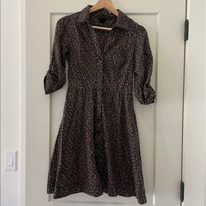 H&M black floral dress. Collared v-neck with button front. Mid length sleeves.